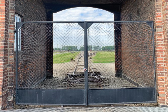 Auschwitz-Birkenau guided tour from Krakow with a private transport - Entering Auschwitz I with a museum guide