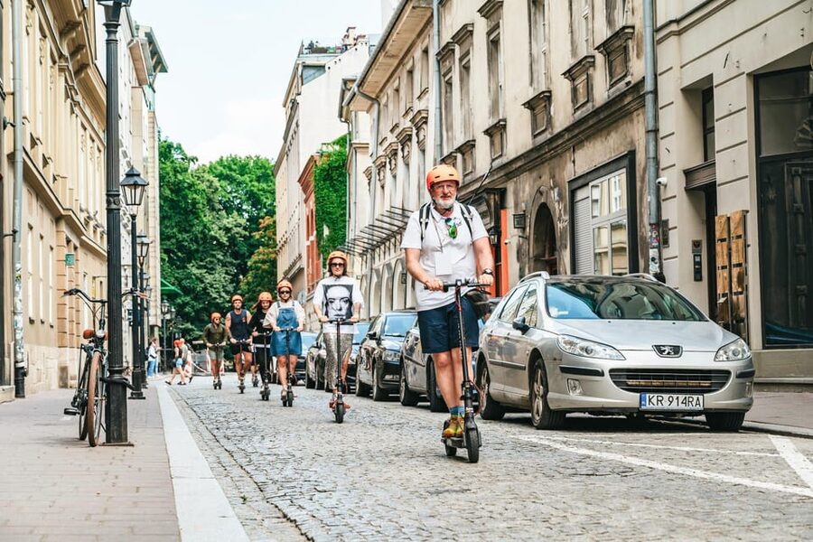 Krakow: Guided E-Scooter City Tour with Food Tastings - St. Mary’s Basilica, Florian’s Gate, and the old university