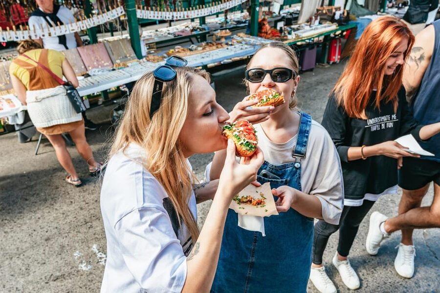 Krakow: Guided E-Scooter City Tour with Food Tastings - Starting at Plac Szczepański and entering the Old Town