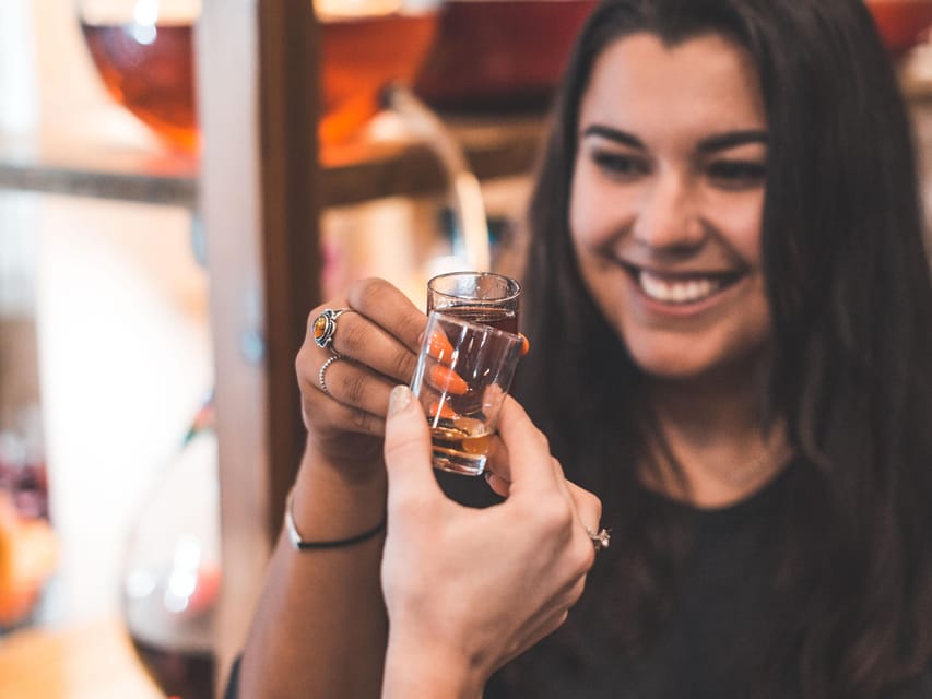 Kraków: Guided Vodka Tour with Food and Drink Tastings - The candlelit bar with more than 100 varieties