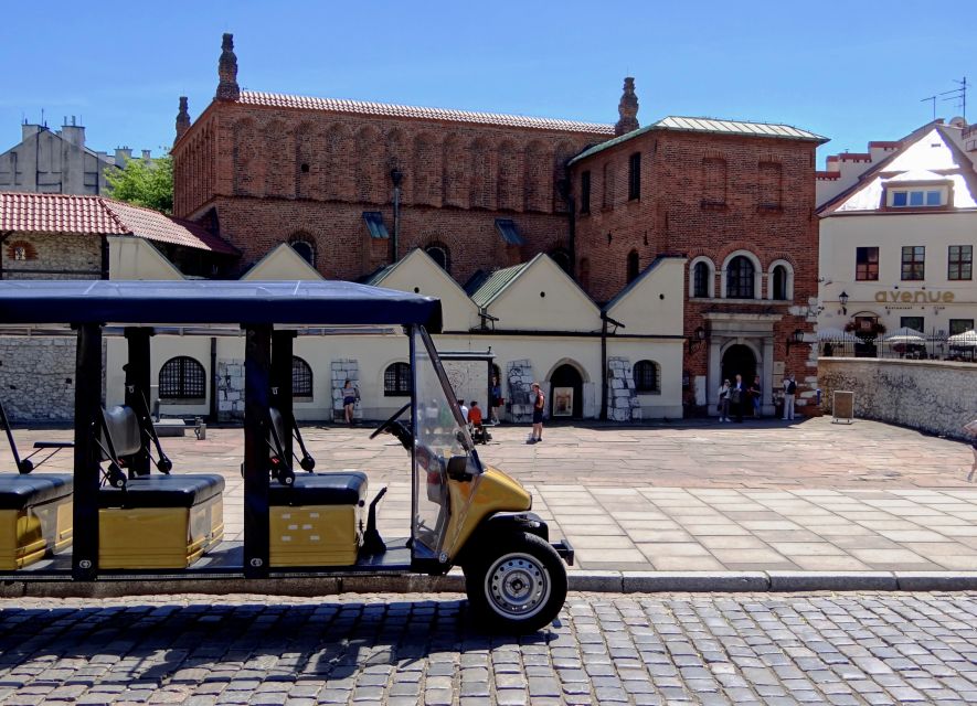 Krakow: Jewish Quarter and Former Ghetto Tour by Golf Cart - Passing Eagle Pharmacy and the remaining wall