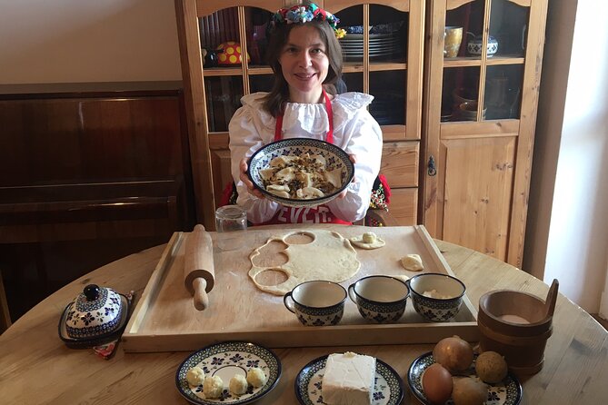 Krakow Pierogi Cooking Class with Market Visit & Home-Cooked Meal - Learning to shape pierogi in a Polish home