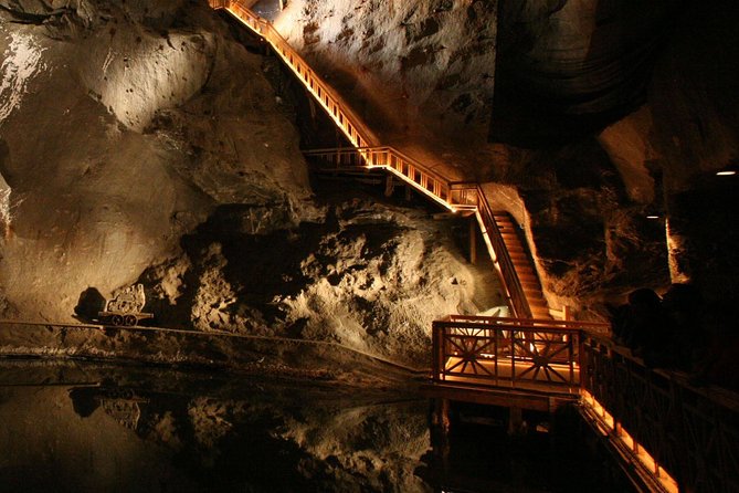 Krakow to Wieliczka: Salt Mine Guided Tour with Ticket & Transfer - Entering Wieliczka and starting the 64-meter descent